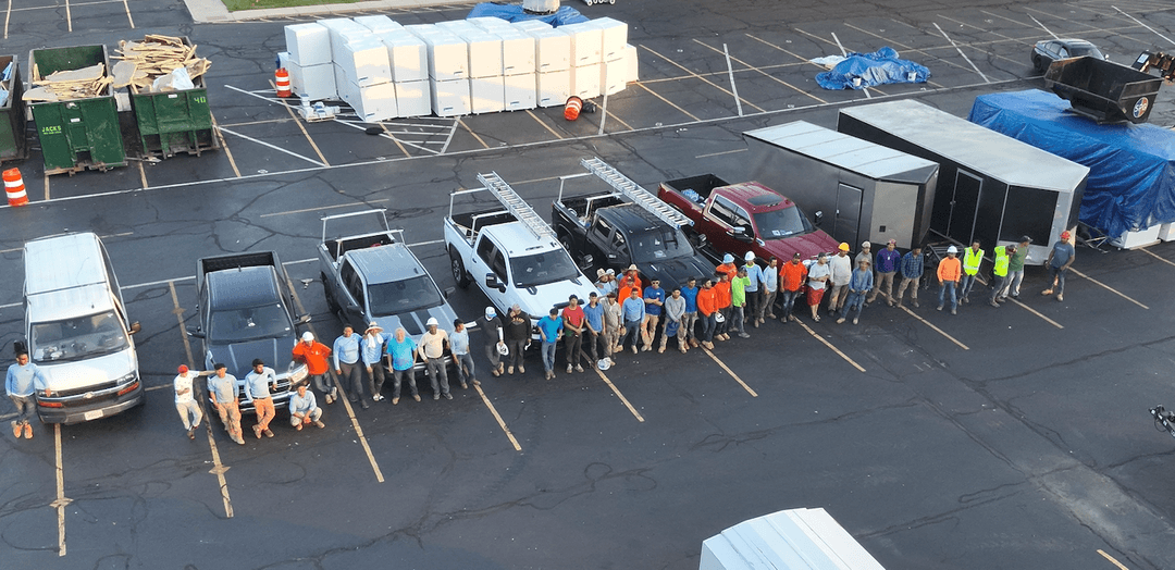 The Amigo crew at work on a commercial roof, drone shot from above
