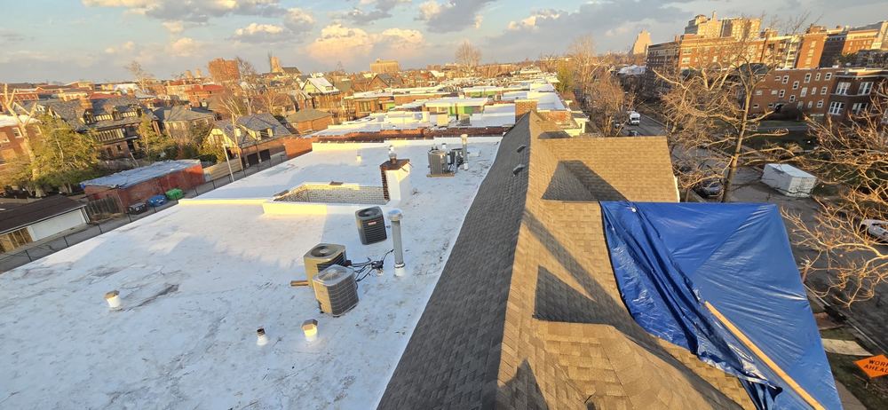 Aerial view of a white commercial flat roof on a long building