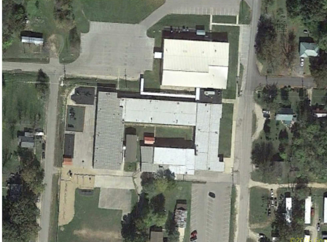 Aerial of an Amigo metal-roof commercial complex
